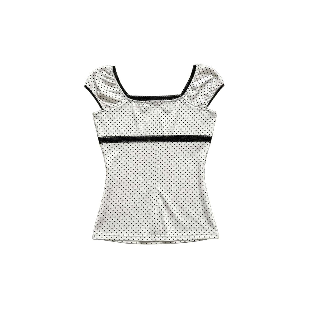 Vintage Polka Dot Puff Sleeve Top This vintage polka dot puff sleeve top features a inspired square neckline with delicate lace trim and short puffed bubble sleeves. Designed with a black lace waist band and a dainty bow detail to create a flattering, cin
