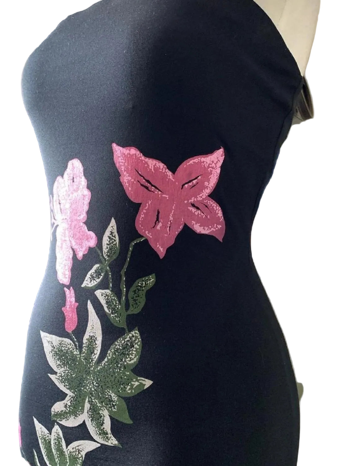 Y2K asymmetric bandeau dress featuring vibrant floral patterns in pink and green on a black background.