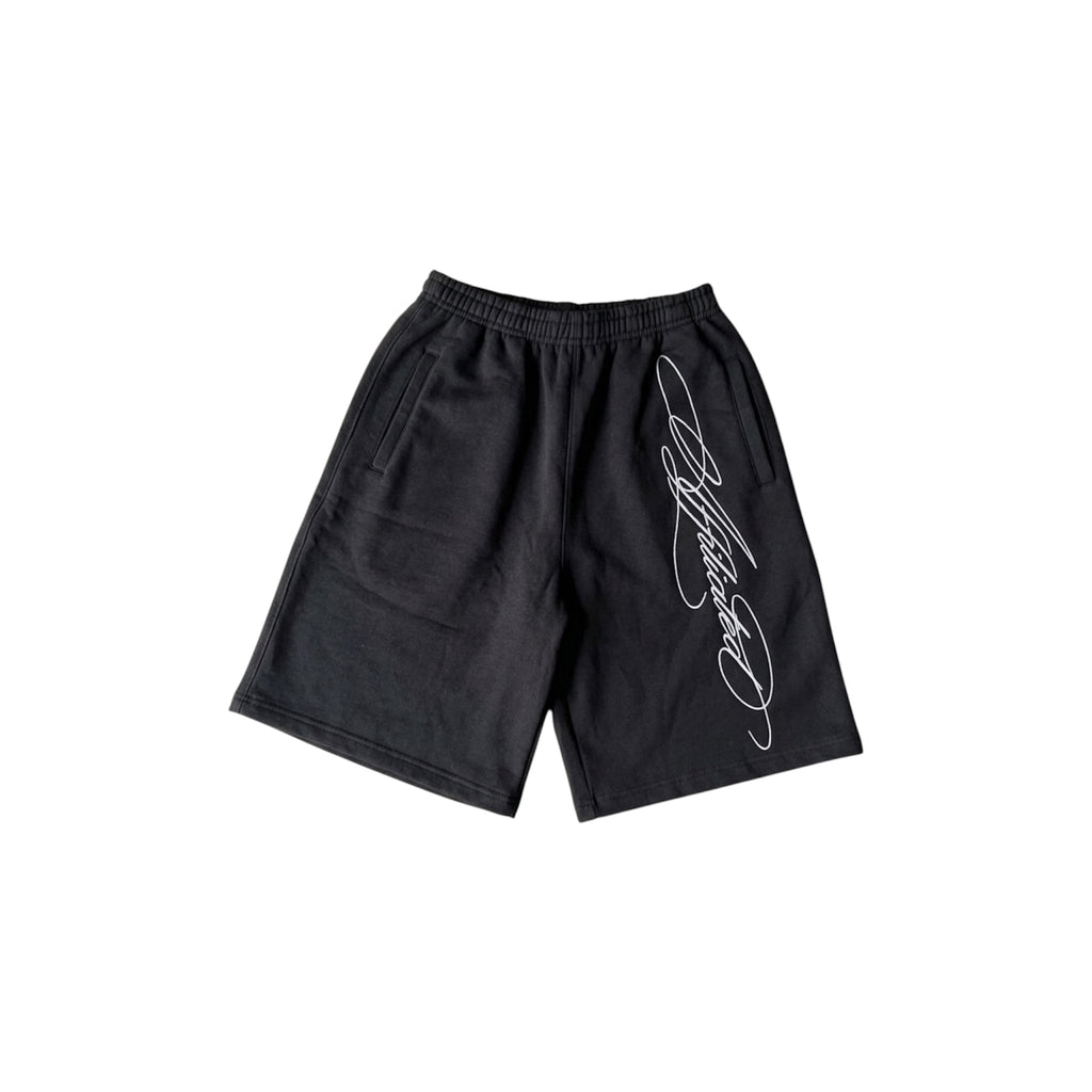 Oversized streetwear shorts in black with a stylized cursive signature design.