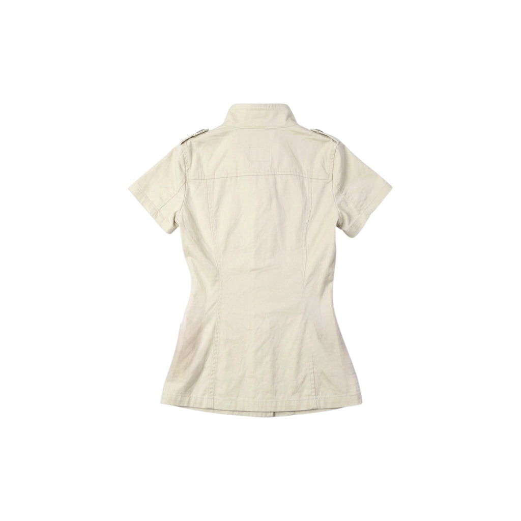 Back view of cream button-front short sleeve jacket showcasing its structured silhouette and high-neck collar.