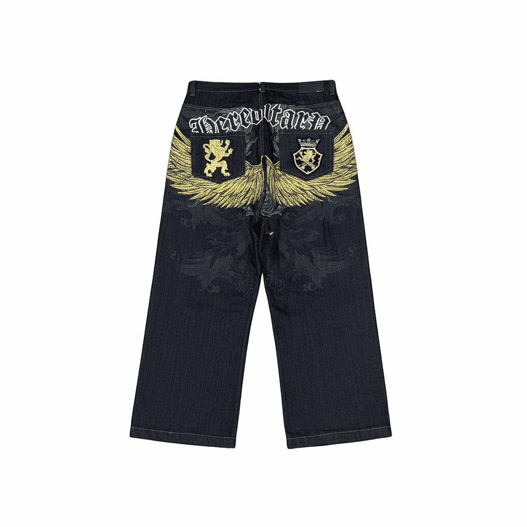 Faded black denim baggy jeans with yellow wing embroidery and heraldic lion motifs in Y2K style