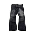 Black Gothic Cross Flared Jeans with metal studs, tassels, and tribal gothic print on thigh