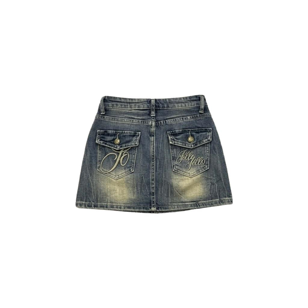 Jello denim mini skirt with embroidered back pockets and faded sand wash
