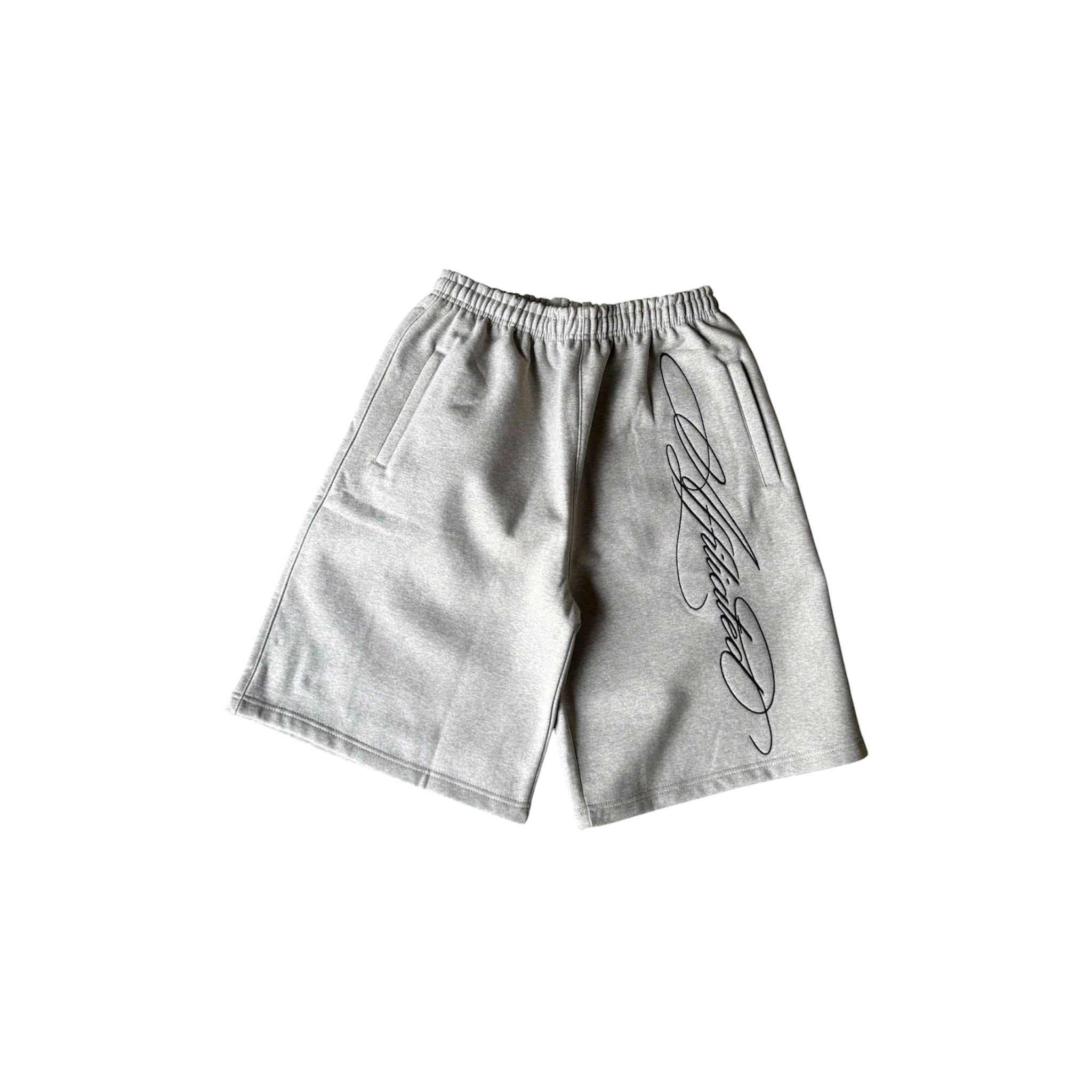 Oversized black streetwear shorts with cursive signature print