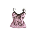 Pink cami top with leopard print trim and decorative bows, slim fit cropped Y2K style